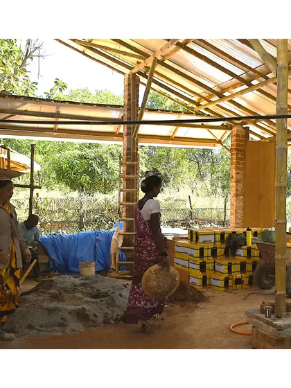 A wide shot of the bustling construction site at Cheerville. It shows our women masons engaged in various tasks, highlighting the active and collaborative environment of our projects.
