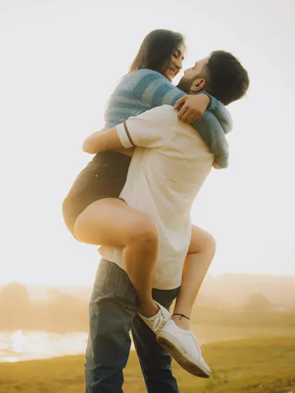 A playful lift against the golden hour light. We encourage couples to have fun during their pre-wedding shoot, resulting in dynamic and joyful photos that truly represent their relationship.