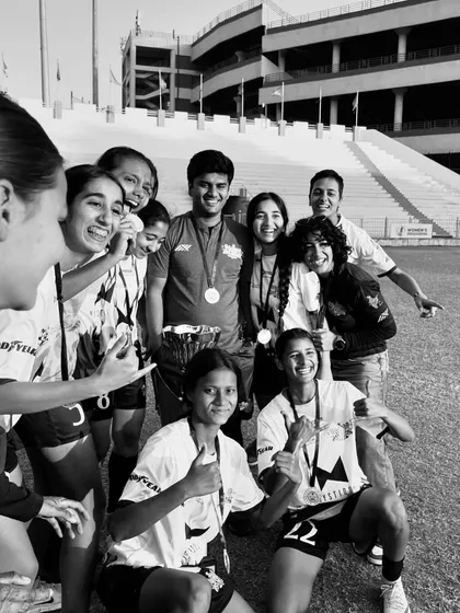 Candid joy. The team sharing a laugh after their win, a testament to the strong bonds forged through shared struggle and success.