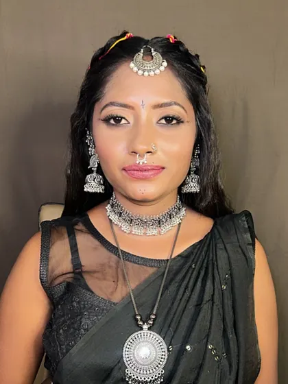 A close-up of the Dandiya night makeup. The look is bold, with defined eyes and traditional silver jewelry.