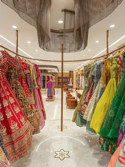 A vibrant display of lehengas at the Nalli flagship store. For this retail project, we designed custom circular racks to create a dynamic and immersive shopping experience, using color and form to tell the brand's story.