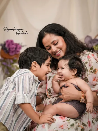 A family is a story of love. We focus on capturing those unscripted, joyful interactions, like this moment between a mother, her son, and their newest family member, creating memories that feel as warm as the hug itself.