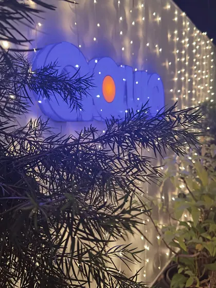 The Aqua logo glows against a wall of festive lights. We love to celebrate festivals like Deepawali and create a special ambiance for our guests.