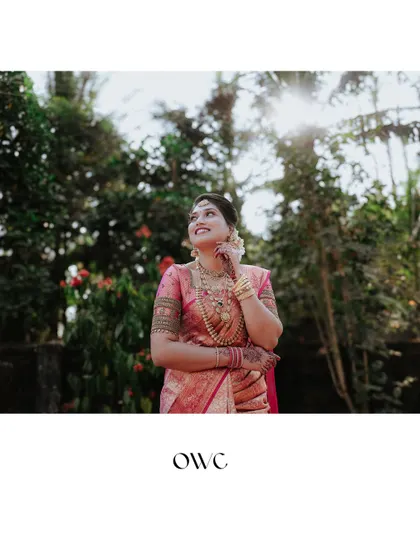 A beautiful shot of the bride looking up, with the sun creating a lovely flare behind her.