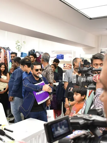 In the middle of a media scrum at a store launch. I am experienced in handling press and ensuring the event runs smoothly under pressure.