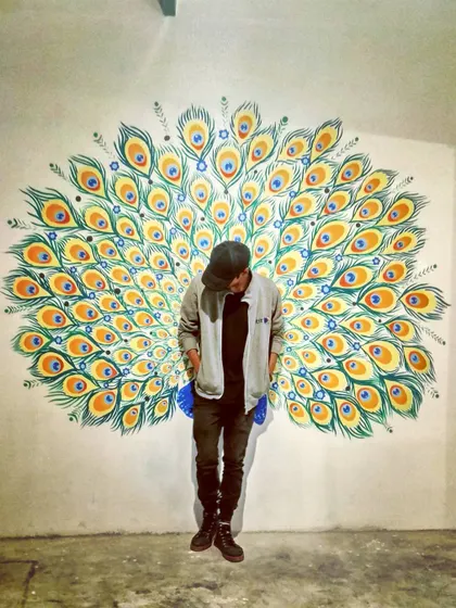 Flex! This peacock feather mural at Le Terrace in Nagarbhavi is another one of our selfie walls. The vibrant colors and fanned out design create a stunning backdrop for photos.