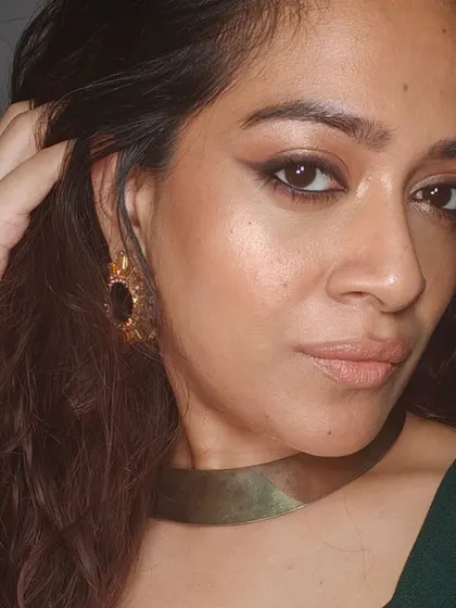 A candid shot of my festive look. The makeup catches the light beautifully, creating a radiant and healthy glow.