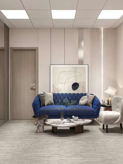 A waiting area in the Neemrana office, where a bold blue sofa adds a pop of color that reflects the brand's logo, creating a cool and trustworthy vibe.