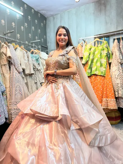 A full-length view of our layered princess gown in dusty pink. The structured skirt and embellished bodice are perfect for creating a fairytale look.