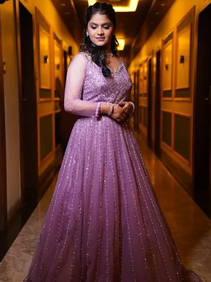 Another beautiful shot in the hallway, where the lighting highlights the shimmer in her makeup and gown.