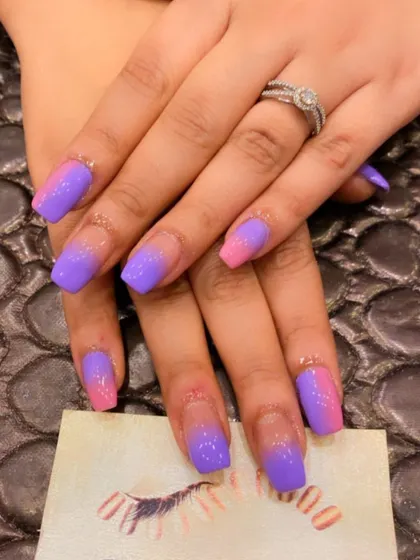 A vibrant and fun ombre on coffin-shaped nails. This set features a bold gradient from a bright pink base to a rich purple at the tips.