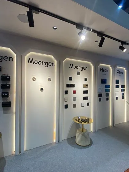 A closer look at our product display wall at an exhibition. We showcase a variety of smart panels from leading brands like Moorgen and Xeon, allowing architects and clients to see and feel the quality of our offerings.