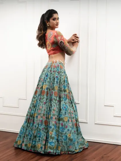 Discover the beauty of traditional craftsmanship with this stunning Pen Kalamkari lehenga. The piece is meticulously hand-painted by my artisans, with a story unfolding on the blouse sleeves and a beautiful floral pattern on the skirt and dupatta.