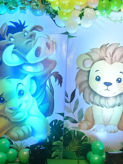 I use custom-printed panels for every event, never reused flex. This close-up shows the high-quality Lion King artwork for a jungle party.