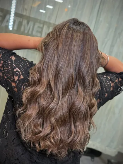 The beautiful back view of this cool-toned look, showing off the long, healthy waves.