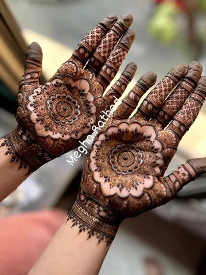 A classic and beloved style, this design features intricate mandalas on the back of the hands. The patterns extend up the fingers, creating a look that is both traditional and always in style.