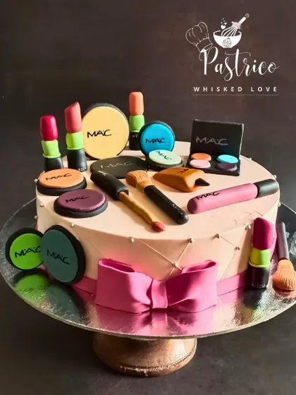 A makeup lover's dream cake, fully loaded with edible MAC makeup products, from lipstick to eyeshadow.