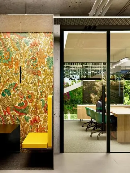 In this co-living space, we used traditional Kalamkari-inspired wallpaper inside a modern phone booth. This juxtaposition of old and new is a tribute to local culture, creating a space that is both globally modern and deeply rooted in its context.