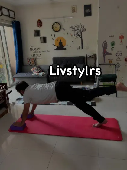A client in a challenging plank variation with one leg lifted, using blocks for support. This advanced move builds incredible core and upper body strength.