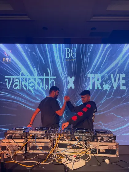 A shot of me and TRAVE sharing a moment of camaraderie on stage. Our back-to-back DJ sets are all about synergy.