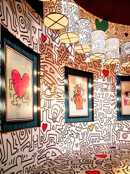 Another view of the Keith Haring room, showcasing the framed art and doodle-covered walls. The design embraced his distinctive approach, which was influenced by cartoons and graffiti.