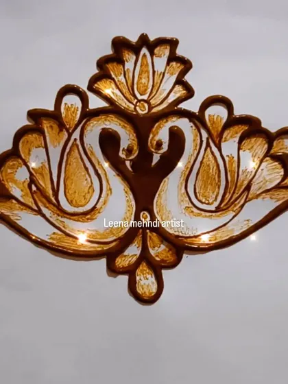 A beautiful swan motif designed to look like a traditional diya or lamp. This shows how you can creatively combine different ideas in your art.