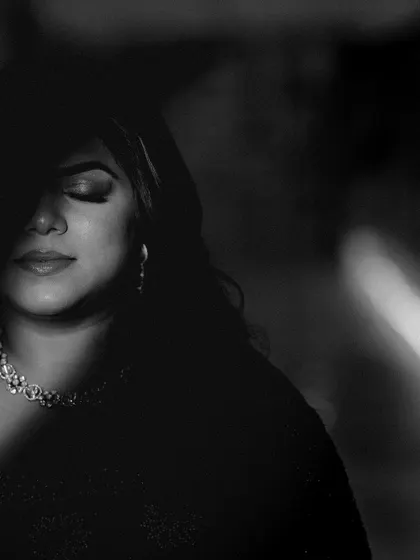 An artistic black and white portrait using shadow to create a mysterious and beautiful image.