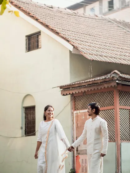A beautiful shot of the couple walking and holding hands, with the soft light creating a lovely, warm atmosphere.
