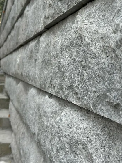 Another detail of the stacked stone, showing the rough, natural face of the material. We celebrate this honesty in our work.