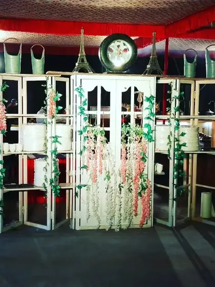 I can also create themed setups to match your event's decor. This is a rustic-chic food station I designed using white wooden crates and floral arrangements for an outdoor party.