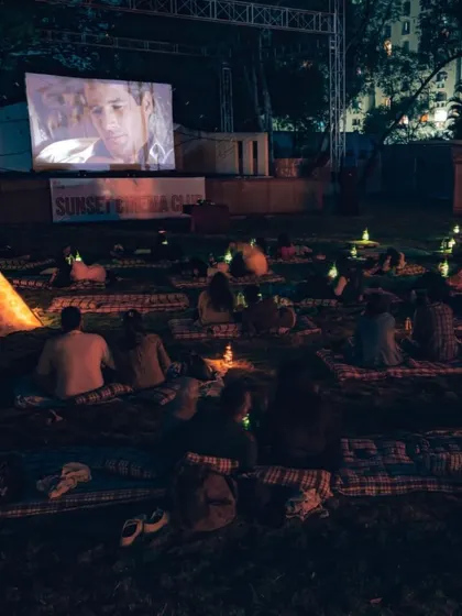 Watching a classic film on a massive screen surrounded by greenery and soft lighting. This setup at SCC Republic in Pune shows how we blend nature with cinema for a truly memorable night.
