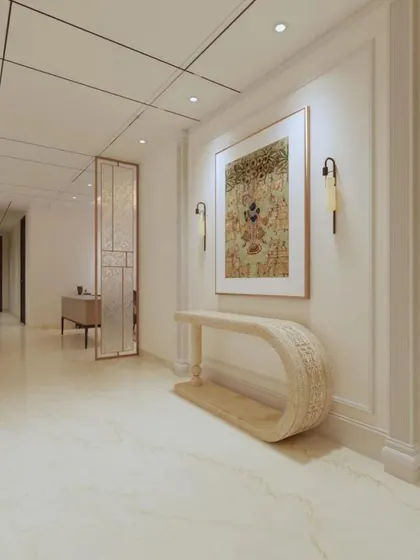 The elegant entryway of the Platinum Tower apartment, featuring a modern console table and curated artwork.