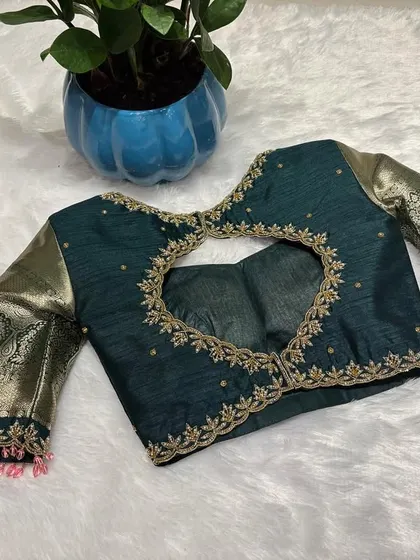Where tradition meets glam. This hand-embellished bottle green blouse is all about the details.