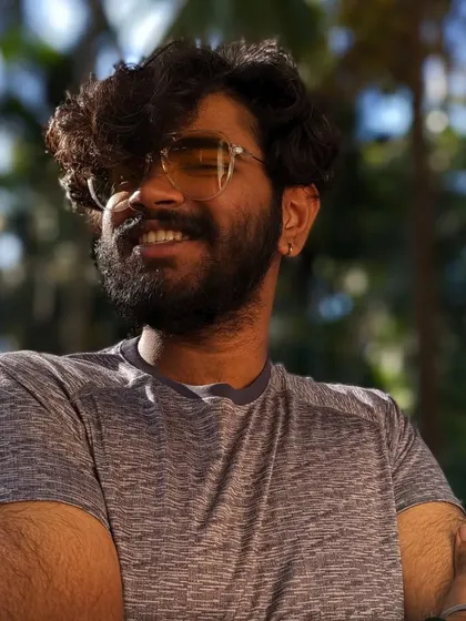 A relaxed, smiling portrait taken outdoors. This shows a more personal and down-to-earth side of me.