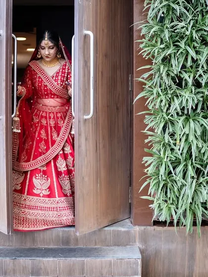 The bride takes a deep breath as she steps out for her 'first look' with the groom. We capture the nerves and excitement of this special moment.