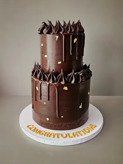 I call her the chocolate goddess. A two-tier chocolate drip cake for a corporate promotion celebration at Ernst & Young.
