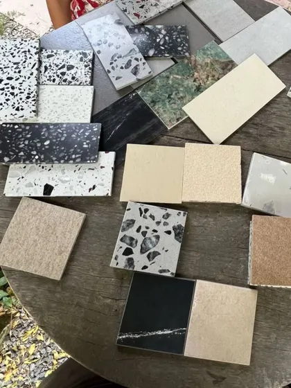 A selection of terrazzo and stone samples being considered for a project. Material selection goes beyond aesthetics; it’s about how surfaces feel to the touch and how their character can guide movement and define the rhythm of a space.