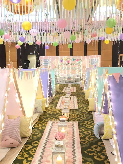 A slumber party, but make it magical. I designed this dreamy setup with individual teepees, fairy lights, and plush cushions to create a cozy and unforgettable birthday experience under a blanket of dreams.