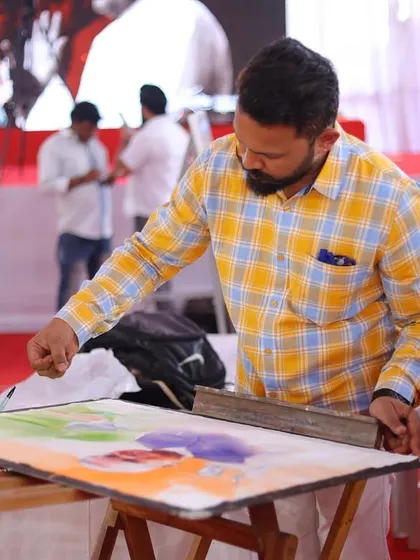 Preparing the paper with initial washes of colour, setting the tricolour theme for the background.
