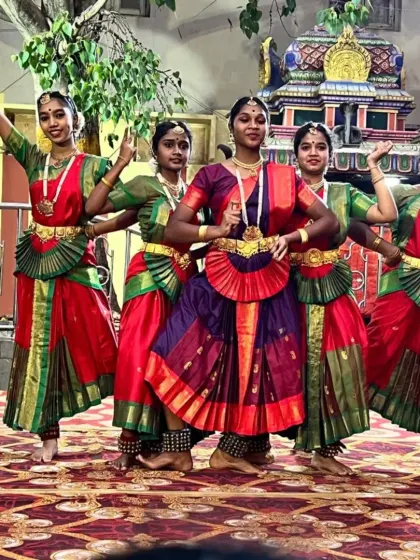 A group of my students in a dynamic pose during their performance at the Karaga Utsava.