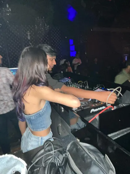 Another candid from a recent club night, showing the setup and the close quarters of the DJ booth.