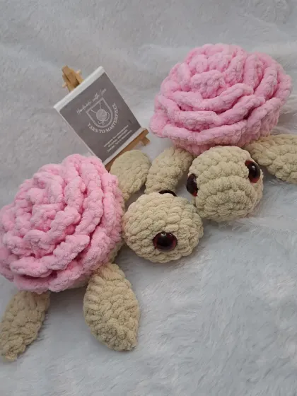 A pair of my rose turtle plushies. These combine the cuteness of a turtle with the beauty of a rose, making for a very unique toy.