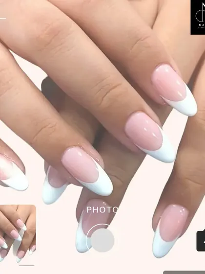 A beautifully executed classic French manicure on long, almond-shaped nails. This look is eternally stylish and perfect for any occasion.