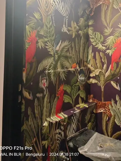 A dark and dense jungle-themed wallpaper, featuring various animals like parrots, monkeys, and leopards.