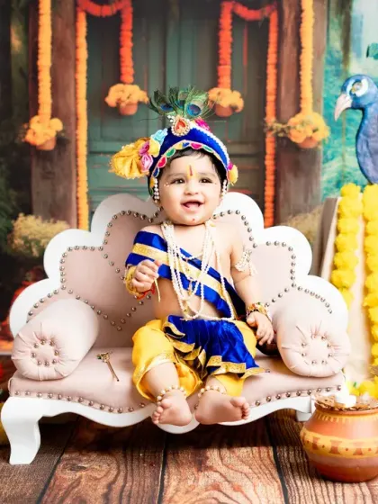 A beautiful portrait of a baby boy dressed as Lord Krishna, complete with a peacock feather crown. This is one of my most requested themed photoshoots for babies and toddlers.