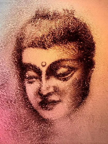 A moment of peace captured in sand. This portrait of Buddha was created for Buddha Purnima, using a blend of colors to evoke a sense of calm and spiritual tranquility.