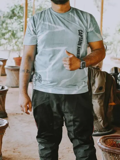 A candid shot of a rider giving a thumbs-up. This simple gesture conveys the positive and encouraging atmosphere of the community meetup.