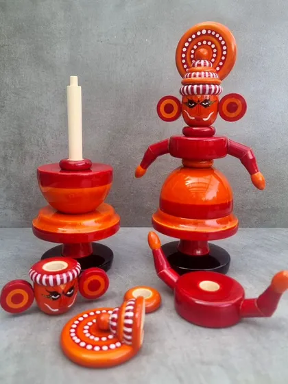 These Theyyam dolls are part of our effort to revitalize Channapatna's toy-making craft. This image shows the stacking doll, which can be reassembled in different forms, and a candle holder version, blending tradition with function.