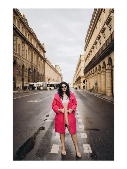 A bold and confident portrait on a Parisian street, highlighting the bride-to-be's style.