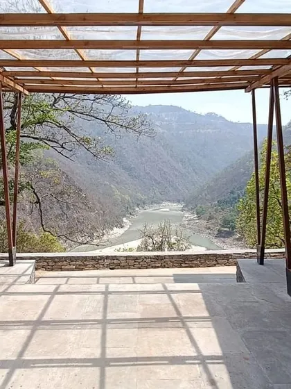 **Angling Centre, Pancheshwar:** This pavilion at the confluence of the Saryu and Kali rivers offers a breathtaking, unobstructed view of the landscape. The open design, supported by angled columns, is intended to frame the natural beauty of the location.